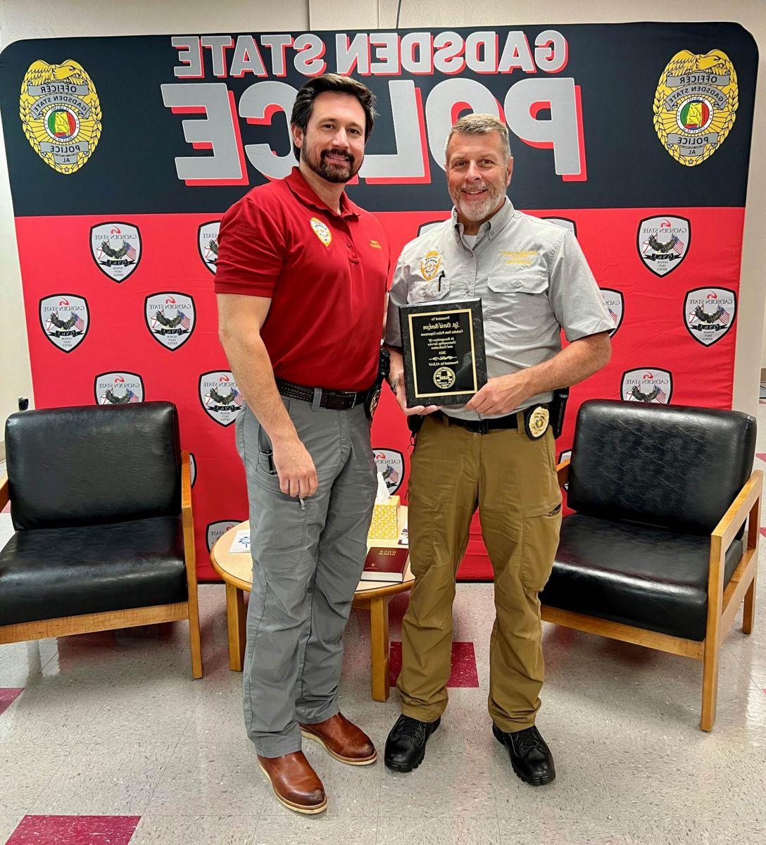 Sgt. David Bankston with Gadsden State Police Chief Jay Freeman after receiving Police Officer of the Year by the Alabama Law Enforcement Appreciation Foundation